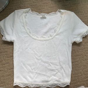 NWOT lace-rimmed GARAGE shirt